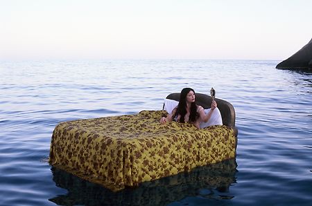 girl%20on%20a%20double%20bed%20floating%20in%20the%20ocean